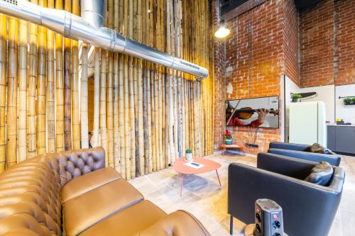 a living room with two couches and a table at ART LOFTS Valencia by Benisur in Valencia