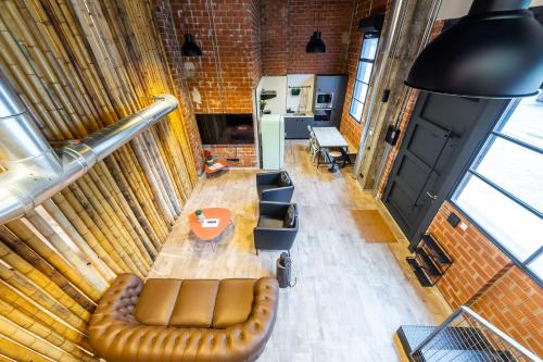 a room with a couch and a table and chairs at ART LOFTS Valencia by Benisur in Valencia