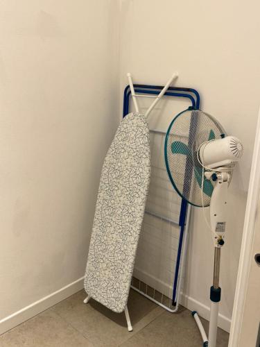 a towel rack with a fan in a room at Celeste's House in Florence