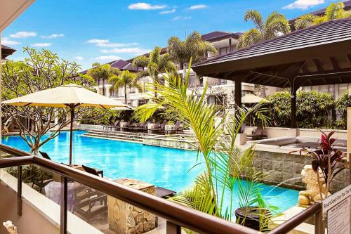 a view of a pool from a hotel balcony at 119 Santai Resort - Poolside Apartment by uHoliday in Casuarina
