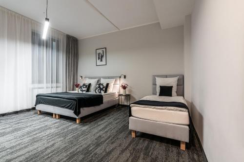 Ένα ή περισσότερα κρεβάτια σε δωμάτιο στο VANTA Business Center