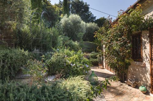 a garden with plants on the side of a building at Villa Cri Cri B&B di Charme in San Benedetto del Tronto