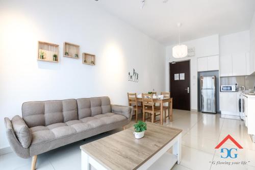 a living room with a couch and a table at Astoria Ampang By Grabstay in Kuala Lumpur
