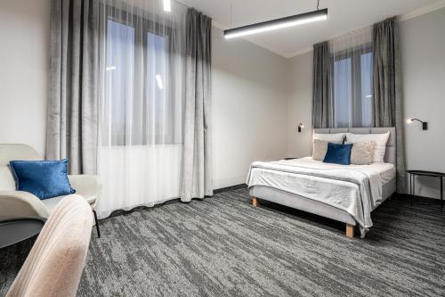 Ένα ή περισσότερα κρεβάτια σε δωμάτιο στο VANTA Business Center