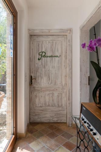 a wooden door with the word forgiveness written on it at Villa Cri Cri B&B di Charme in San Benedetto del Tronto