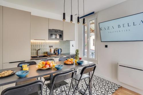a kitchen with a table with bowls of fruit on it at KAZA BELLA - Maisons Alfort 8 Modern large apartment in Maisons-Alfort