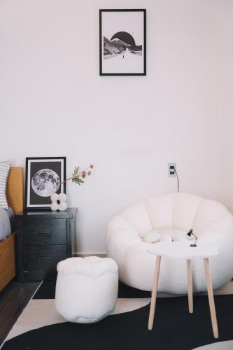 a living room with a white couch and a table at Darest's Home in Da Lat