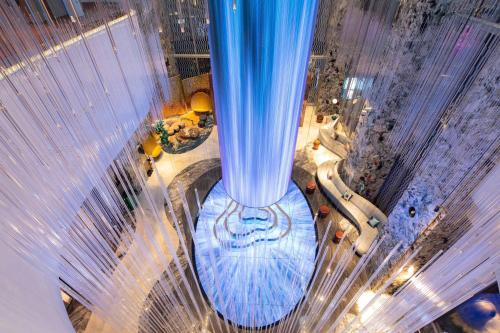 an overhead view of a large blue column in a building at W Chengdu in Chengdu