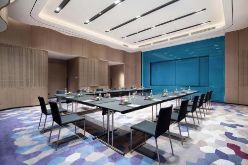 a large conference room with a long table and chairs at W Chengdu in Chengdu
