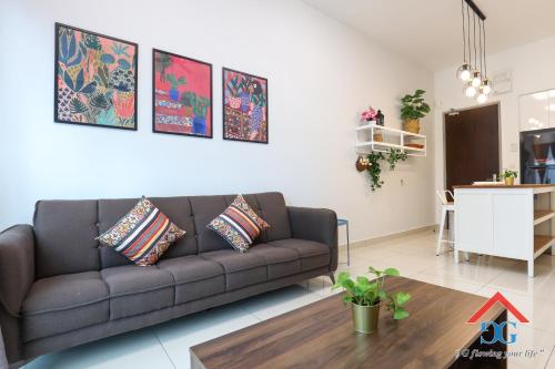 a living room with a couch and a table at Astoria Ampang By Grabstay in Kuala Lumpur
