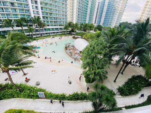 an aerial view of a swimming pool in a resort at Azure Staycation By Dubai Cabin in Manila