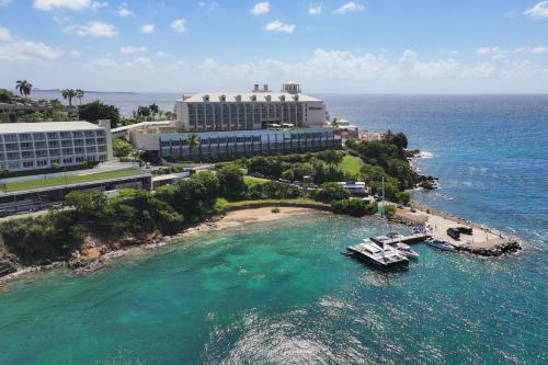 an aerial view of a resort with a boat in the water at The Westin St Thomas Beach Resort & Spa in Frydendal