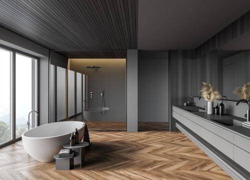 a bathroom with a white tub and two sinks at Hanza Tower Gold - 24 Pool & SPA in Szczecin