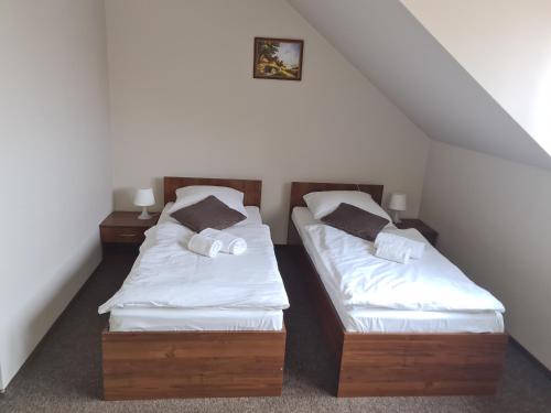 Una cama o camas en una habitación de Gościniec Oaza Sorkwity