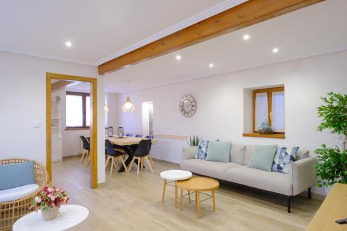 a living room with a couch and a table at La Era de Casaus in Gavín