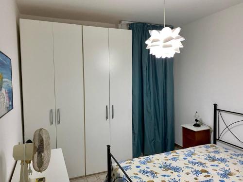 Postel nebo postele na pokoji v ubytování Dora e Franco Apartment treseiseiseiquattroseicinquezeroottozero