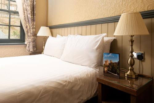 Katil atau katil-katil dalam bilik di The Kingslodge Inn - The Inn Collection Group