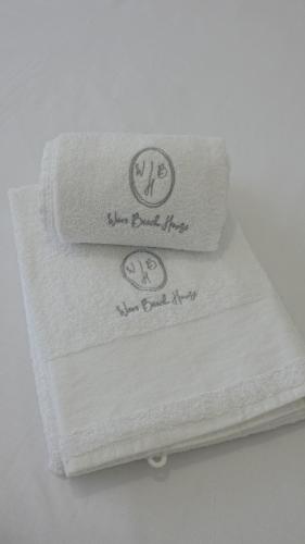 two towels stacked on top of each other at Wave Beach House in Vila do Conde