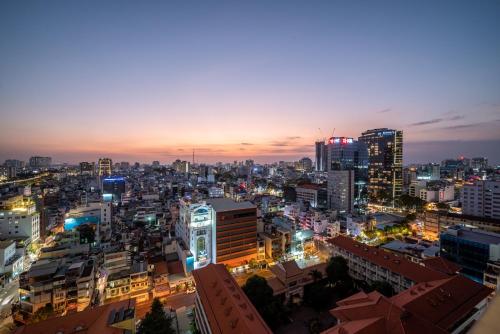 a view of a city at night at Otis Soho Saigon Balcony Apartment in Ho Chi Minh City