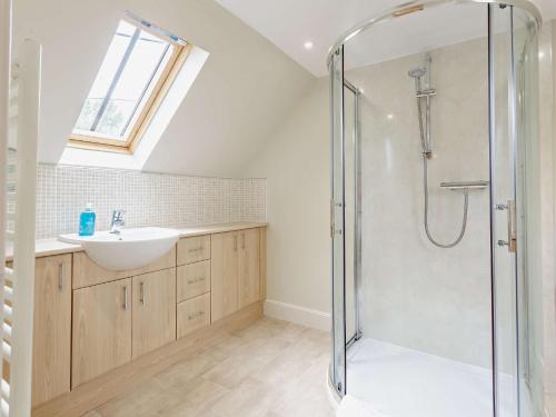 a bathroom with a shower and a sink at 3 Bed in Conon Bridge CA388 in Cononbridge