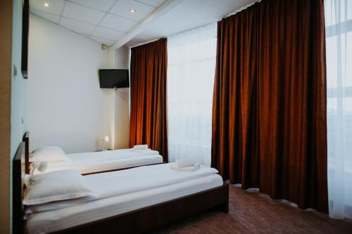 Ένα ή περισσότερα κρεβάτια σε δωμάτιο στο Hotel Select