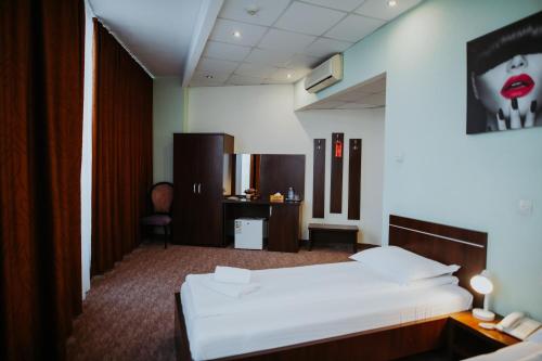 Ένα ή περισσότερα κρεβάτια σε δωμάτιο στο Hotel Select