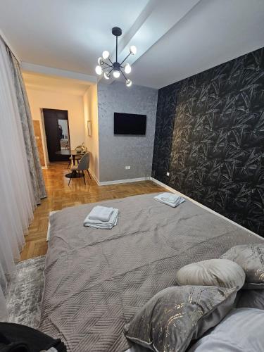 Ένα ή περισσότερα κρεβάτια σε δωμάτιο στο Apartman Florida