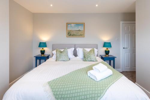 Ένα ή περισσότερα κρεβάτια σε δωμάτιο στο Stag Lodge at Sherwood