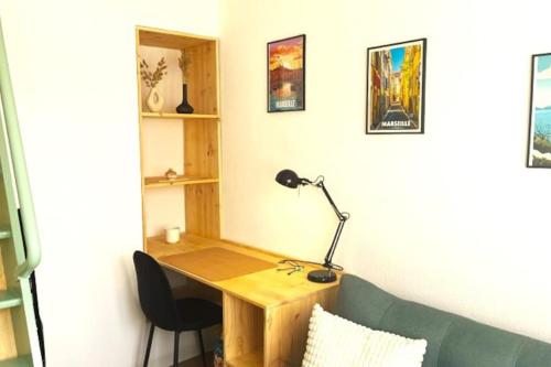 a desk with a lamp and a chair in a room at Chez Martin - Studio Timone St Pierre Palais omnisports in Marseille