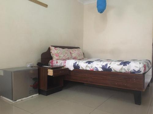 A bed or beds in a room at Villa Ntowe Lodge