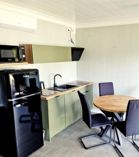 Kuchyň nebo kuchyňský kout v ubytování Apartamenty Niegocin
