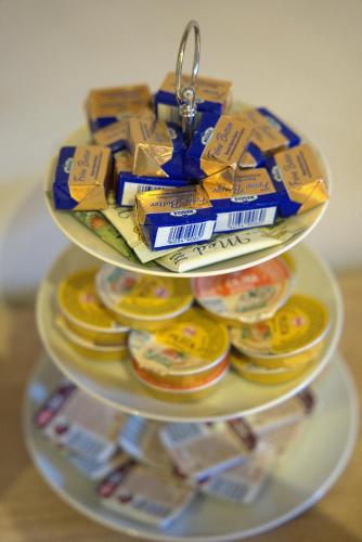 a plate of food with a key chain on top at Boutique Hostel Livia in Metković