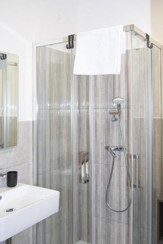 a bathroom with a shower and a sink at Le Sere in Reggio Calabria