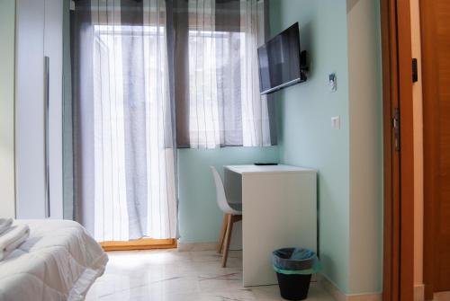 TV a/nebo společenská místnost v ubytování Le Sere