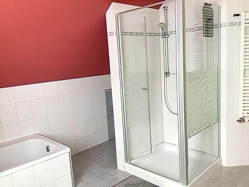 a bathroom with a shower and a tub and a toilet at Ferienwohnung Tor zur Natur in Münchberg