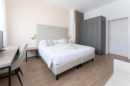 Postel nebo postele na pokoji v ubytování Hotel Excelsior