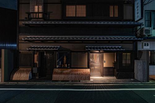 a building on a street at night at Saju Kyoto 茶住 京都 in Kyoto