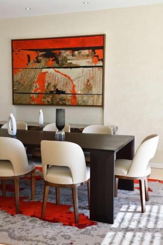 a dining room with a table and chairs at Hilton Taghazout Bay Beach Resort & Spa in Taghazout