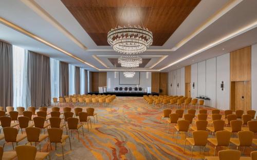 a large room with chairs and a stage in the background at Hilton Skanes Monastir Beach Resort in Monastir