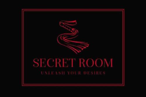 a red logo for a secret room underneath your desires at BDSM apartmán v Bratislave -ADULTS ONLY in Bratislava