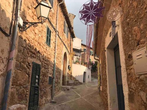 an alley with a street light on a building at Casa pi in Bunyola
