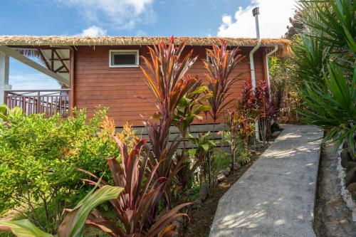 a house with a pathway leading to it at Muri Motu Outlook in Rarotonga