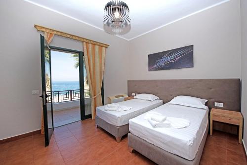 Postel nebo postele na pokoji v ubytování Palmanova Beach Mardok