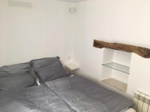 a bedroom with a bed and a book shelf at casita limon in Palma de Mallorca