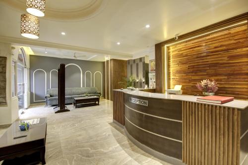 a lobby with a reception desk in a building at HOTEL KASHISH PLAZA in New Delhi