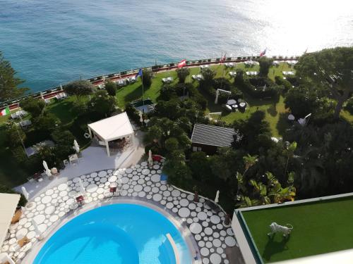 an aerial view of a resort with a swimming pool at Grand Hotel Del Mare Resort & Spa in Bordighera