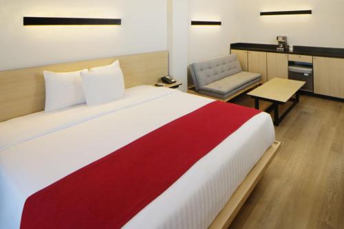 Кровать или кровати в номере City Express by Marriott Nuevo Laredo