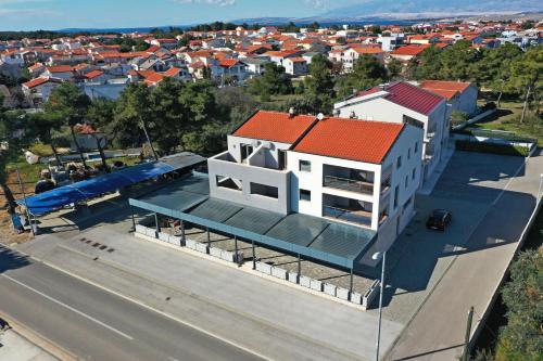 an overhead view of a building with a red roof at APARTMANI PETRA in Vir