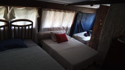 En eller flere senge i et værelse på Pousada e restaurante Renascer