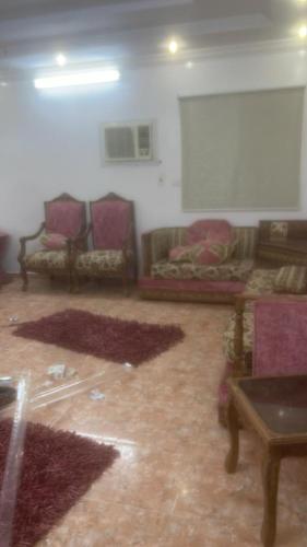 a living room with couches and rugs at شقة عائلية مفروشةFurnished family apartment for rent in Tabuk